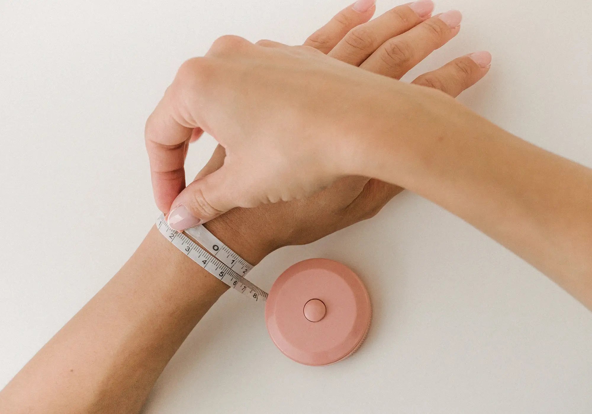 Measuring a wrist with a tape measurer