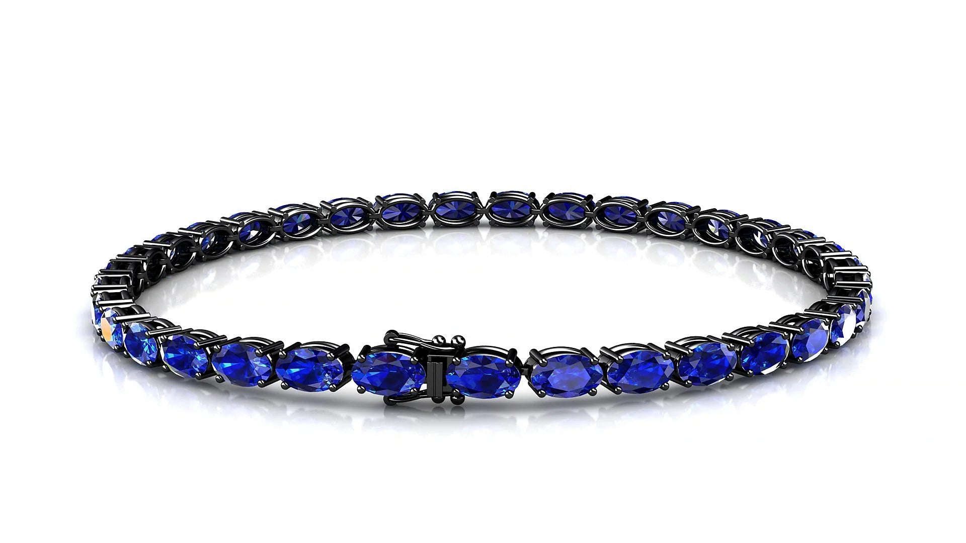 Pula | 18k Black Gold 5 x 3 mm Oval Natural Sapphire 18 cm Tennis Bracelet