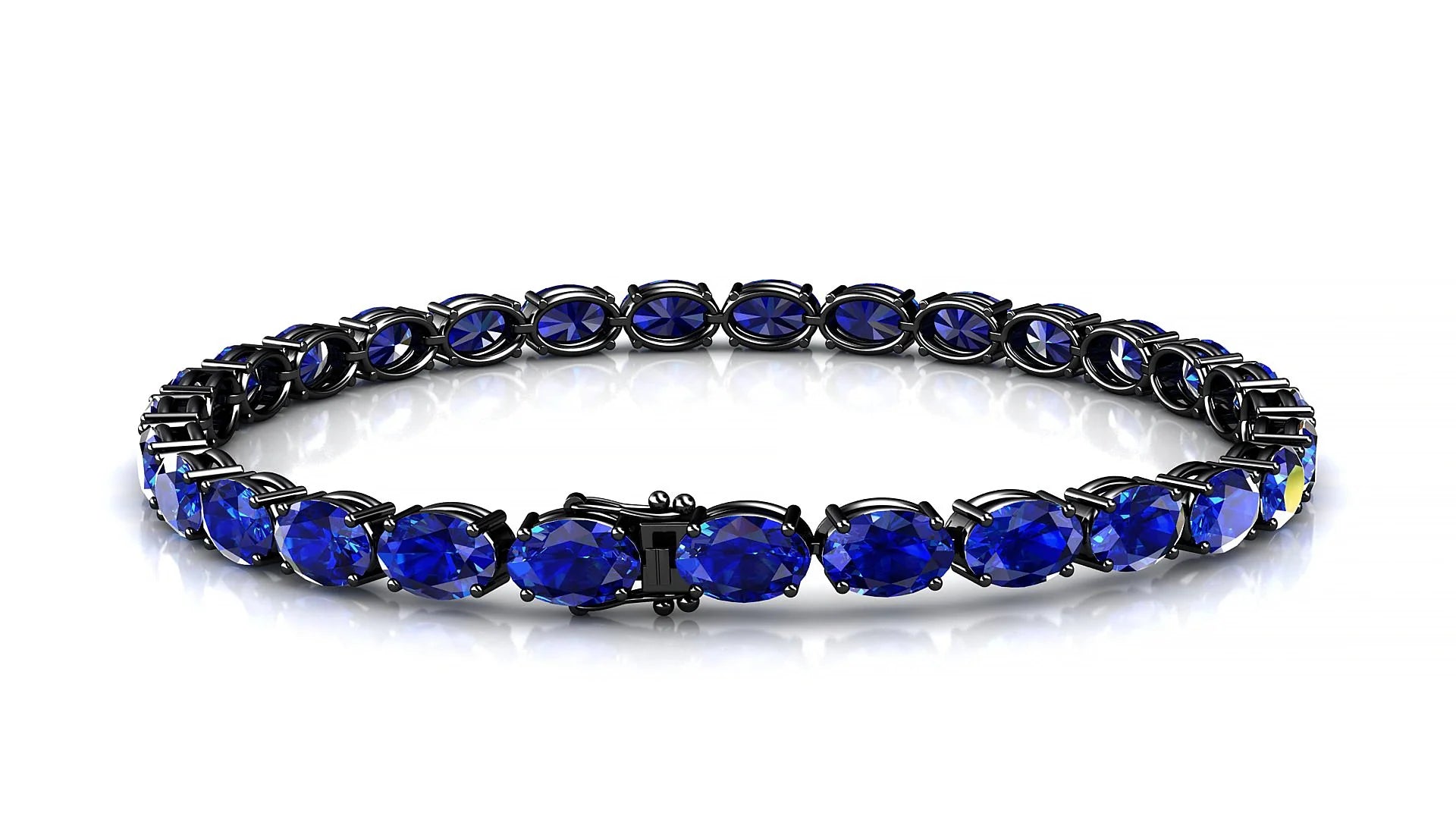 Pula | 18k Black Gold 6 x 4 mm Oval Natural Sapphire 18 cm Tennis Bracelet