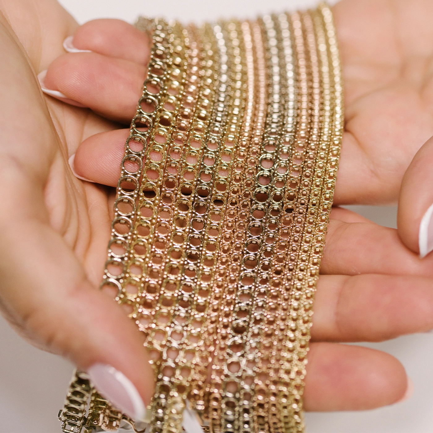 Gold tennis bracelet mountings in 18k white, yellow and rose gold.