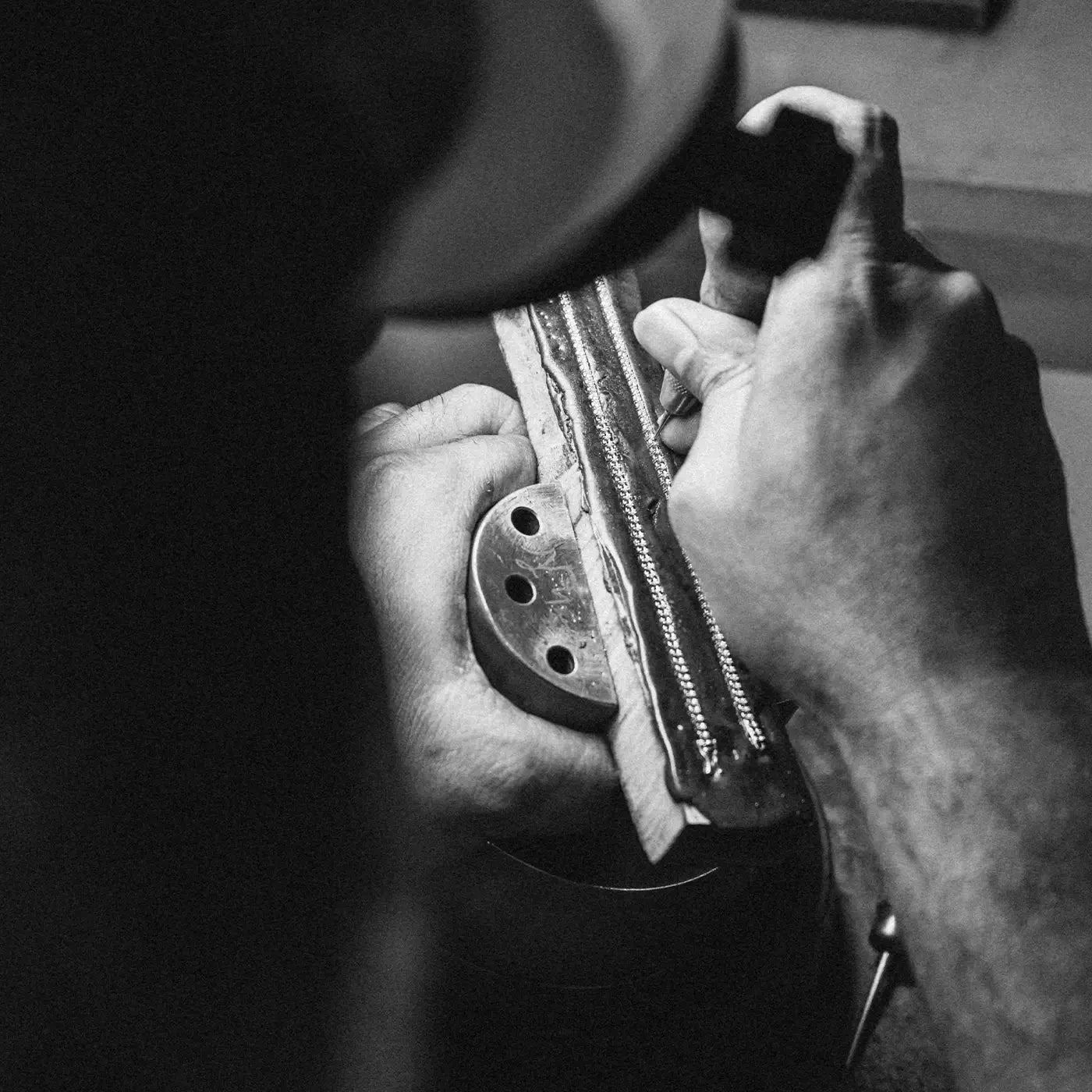Two tennis bracelets being set with diamonds